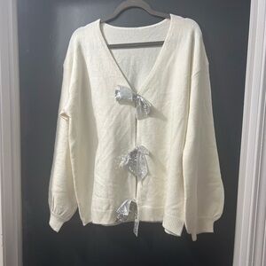 Elegant Cream Sweater with Silver Accents